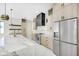 Stylish kitchen featuring stainless steel appliances, marble countertops, and custom cabinetry at 1741 Nevada Ne Ave, St Petersburg, FL 33703
