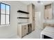 A stylish kitchenette with black shelving, a wine cooler, and modern cabinetry at 1741 Nevada Ne Ave, St Petersburg, FL 33703