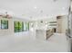 Expansive living area with white marble floors and a modern kitchen island at 1741 Nevada Ne Ave, St Petersburg, FL 33703