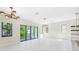 Bright living room with sliding glass doors leading to the outside and modern lighting fixtures at 1741 Nevada Ne Ave, St Petersburg, FL 33703