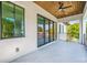 Spacious covered patio with sleek railings, wood ceiling and tile flooring at 1741 Nevada Ne Ave, St Petersburg, FL 33703
