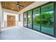 Inviting covered patio with wood ceilings, sleek railings, and tiled floors at 1741 Nevada Ne Ave, St Petersburg, FL 33703