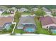 An aerial view of the home showcasing the pool and neighborhood at 18413 Eastwyck Dr, Tampa, FL 33647