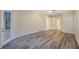 Large bedroom with wood floors, multiple doors, and neutral wall colors, creating a serene atmosphere at 18413 Eastwyck Dr, Tampa, FL 33647