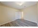 A minimalist bedroom is highlighted with modern laminate flooring and a closet at 18413 Eastwyck Dr, Tampa, FL 33647