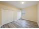 A minimalist bedroom is highlighted with modern laminate flooring and dual closets at 18413 Eastwyck Dr, Tampa, FL 33647