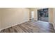 Bright bedroom with wood floors, access to the pool area, and a walk-in closet at 18413 Eastwyck Dr, Tampa, FL 33647