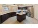 Kitchen featuring stainless steel appliances, an island, and plenty of storage at 18413 Eastwyck Dr, Tampa, FL 33647