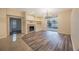 Open living room with a fireplace, built-in shelving, and sliding doors to the outdoor pool at 18413 Eastwyck Dr, Tampa, FL 33647