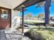 Inviting front porch showcasing decorative tile flooring and a view of the landscaped yard at 1991 67Th S Ave, St Petersburg, FL 33712