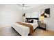 This is a beautifully staged bedroom with warm tones, black accents, and plenty of natural light at 2117 S West Shore Blvd, Tampa, FL 33629