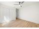 This bright bedroom offers a ceiling fan, spacious closet and wood-look flooring at 2117 S West Shore Blvd, Tampa, FL 33629