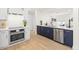 Modern kitchen with stainless steel appliances, breakfast bar, and open to the living area at 2117 S West Shore Blvd, Tampa, FL 33629