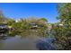 A waterfront view of boat docks, boats, and scenic reflections off the water under a blue sky at 2117 S West Shore Blvd, Tampa, FL 33629