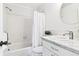 White bathroom featuring a shower-tub combination and a marble vanity at 2124 Crowsnest Dr, Palm Harbor, FL 34685