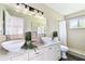 Bright bathroom featuring double vessel sinks, granite countertops, and a tiled shower at 2124 Crowsnest Dr, Palm Harbor, FL 34685