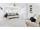 Cozy bedroom featuring soft textures, a ceiling fan, and a view to the outside creating a relaxing atmosphere at 2124 Crowsnest Dr, Palm Harbor, FL 34685