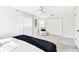 Bright bedroom with large window, ceiling fan, neutral colors, and ample closet space at 2124 Crowsnest Dr, Palm Harbor, FL 34685