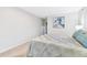 Spacious bedroom featuring carpet, natural light, neutral walls, and a comfortable bed at 2124 Crowsnest Dr, Palm Harbor, FL 34685