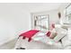 Bedroom offers natural light, and slider door access to lanai, creating an inviting space at 2124 Crowsnest Dr, Palm Harbor, FL 34685