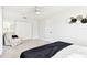 Bedroom featuring a ceiling fan, neutral colors, and double door closet, creating a serene space at 2124 Crowsnest Dr, Palm Harbor, FL 34685