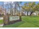 Anchorage is a deed-restricted 55+ community featuring mature trees and a well maintained green lawn at 2124 Crowsnest Dr, Palm Harbor, FL 34685