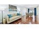 Open concept living and dining area with hardwood floors and lots of natural light at 2124 Crowsnest Dr, Palm Harbor, FL 34685