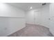 Empty bedroom with neutral carpet, white walls, and a door to the hallway at 21385 Darter Rd, Land O Lakes, FL 34638
