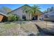 Backyard featuring a patio, mature landscaping, and a house with a covered porch at 2542 Clareside Dr, Valrico, FL 33596