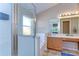 Well-lit bathroom with a glass-enclosed shower, a soaking tub, and a spacious vanity with ample counter space at 2542 Clareside Dr, Valrico, FL 33596