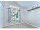 Bright bedroom with a large window and a cozy feel, accented by neutral tones and natural light at 2542 Clareside Dr, Valrico, FL 33596