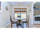 Cozy breakfast nook with wooden table and chairs, next to laundry room at 2542 Clareside Dr, Valrico, FL 33596