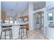 Open concept kitchen and breakfast bar with tile floors and natural light at 2542 Clareside Dr, Valrico, FL 33596