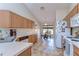 Bright kitchen features white appliances, tiled floor, and wooden cabinets at 2542 Clareside Dr, Valrico, FL 33596