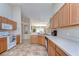 Spacious kitchen featuring ample counter space, tile floors, and natural light at 2542 Clareside Dr, Valrico, FL 33596