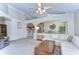 Open-concept living room seamlessly connecting the kitchen and dining areas, creating a spacious and inviting atmosphere at 2542 Clareside Dr, Valrico, FL 33596