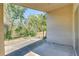 Covered patio overlooking a lush yard with mature trees, offering a private outdoor living space at 2542 Clareside Dr, Valrico, FL 33596
