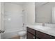 Bathroom featuring a shower-tub combo, toilet, and sink at 2892 Beluga Bay Dr, Odessa, FL 33556