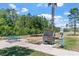 Well-maintained dog park area with pet wash station, bench, and waste disposal station at 2892 Beluga Bay Dr, Odessa, FL 33556
