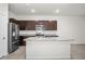 Kitchen features stainless steel appliances, granite countertops, and a spacious island at 2892 Beluga Bay Dr, Odessa, FL 33556
