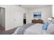 Cozy main bedroom featuring carpeted floors, a comfortable bed, and stylish decor at 2892 Beluga Bay Dr, Odessa, FL 33556