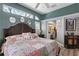 Bright bedroom with high ceilings, transom windows, and a beautiful decorative mirror display at 3003 Magdalene Woods Dr, Tampa, FL 33618
