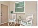 Inviting front porch with brick pavers and seating for relaxing outside at 3003 Magdalene Woods Dr, Tampa, FL 33618