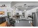 This kitchen features granite countertops, white cabinetry, and bar seating, offering a modern and inviting cooking space at 3003 Magdalene Woods Dr, Tampa, FL 33618