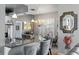 An open kitchen features granite countertops, pendant lighting and gray barstools, offering a blend of style and functionality at 3003 Magdalene Woods Dr, Tampa, FL 33618