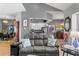 Inviting living room with a comfortable couch, and an open view of the kitchen and dining area at 3003 Magdalene Woods Dr, Tampa, FL 33618