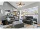 Open-concept living area showcasing modern furnishings and seamless access to the lanai and kitchen at 3003 Magdalene Woods Dr, Tampa, FL 33618