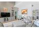 Bright living room featuring stylish seating, modern decor, and a seamless flow to other rooms at 3003 Magdalene Woods Dr, Tampa, FL 33618