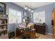 Bright home office with plenty of desk space, natural light, and built-in shelving at 3003 Magdalene Woods Dr, Tampa, FL 33618