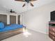 Comfortable bedroom with ceiling fan, large windows and natural light at 3194 Brookview Ave, Largo, FL 33771